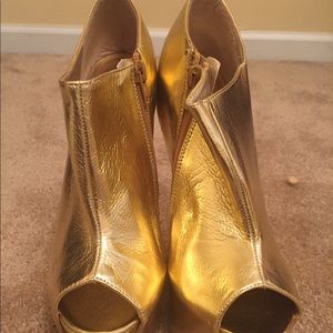 Gold platform heeless shoe by Glaze
